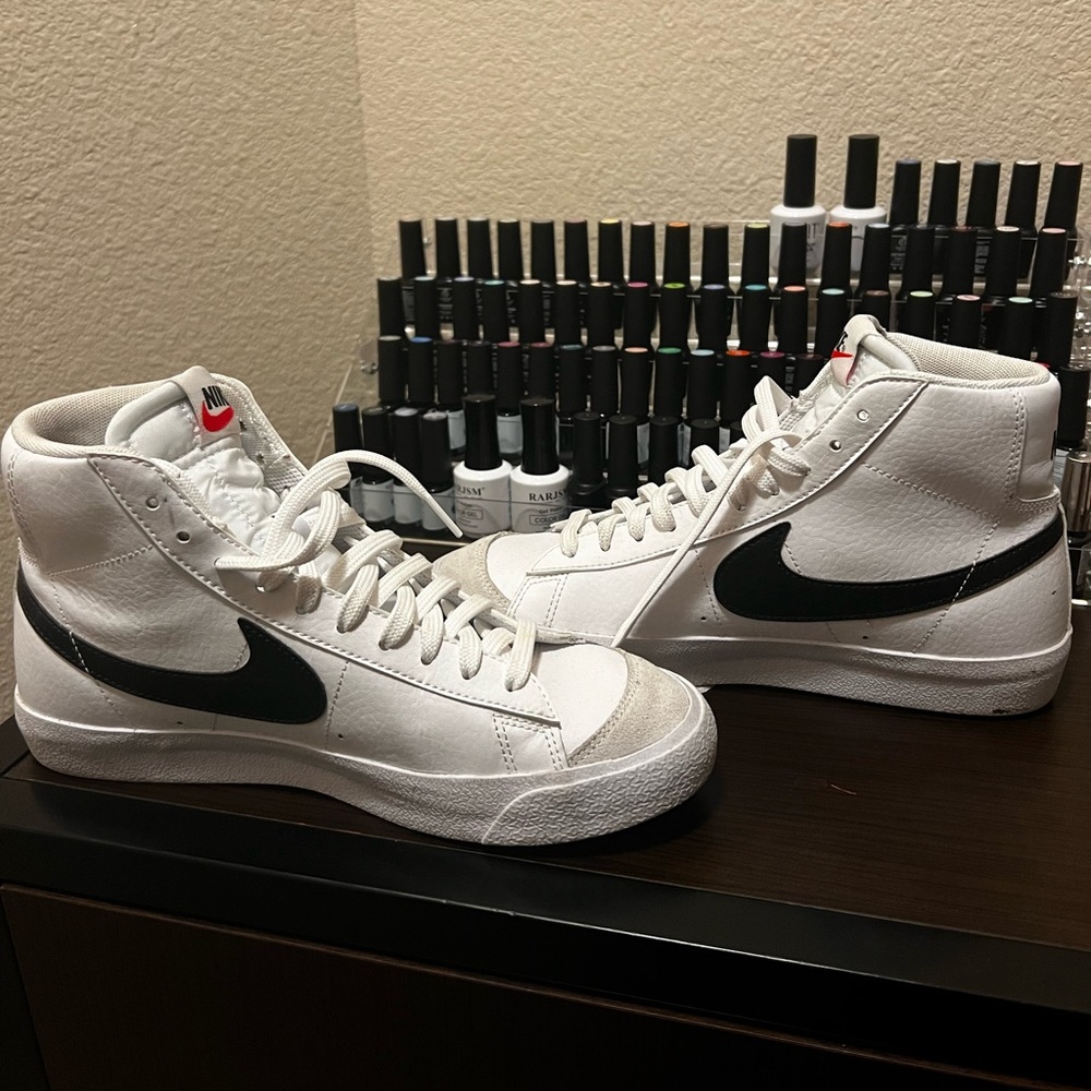 Black and white high top Nike Blazers.